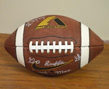 Football signed by football coaching staff