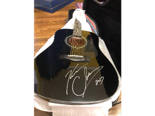 Kenney Chesney autographed Fender guitar