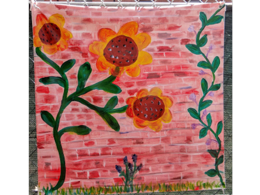 Sunflowers Against Brick Background