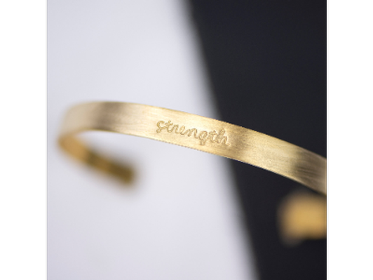 Strength: stamped brass bracelet