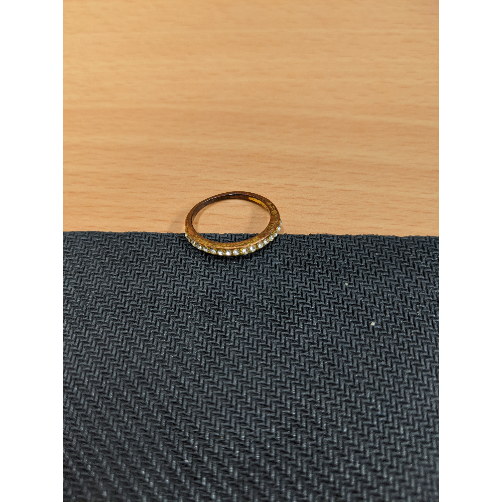 Gold ring with diamond look stones