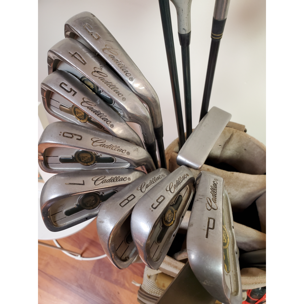 Golf clubs with Cadillac irons and other clubs