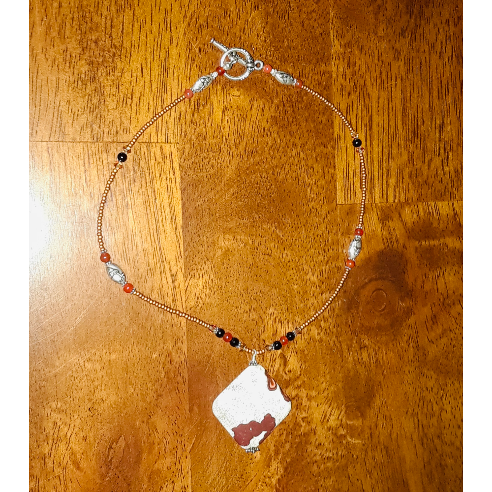 Beaded necklace with pony stone