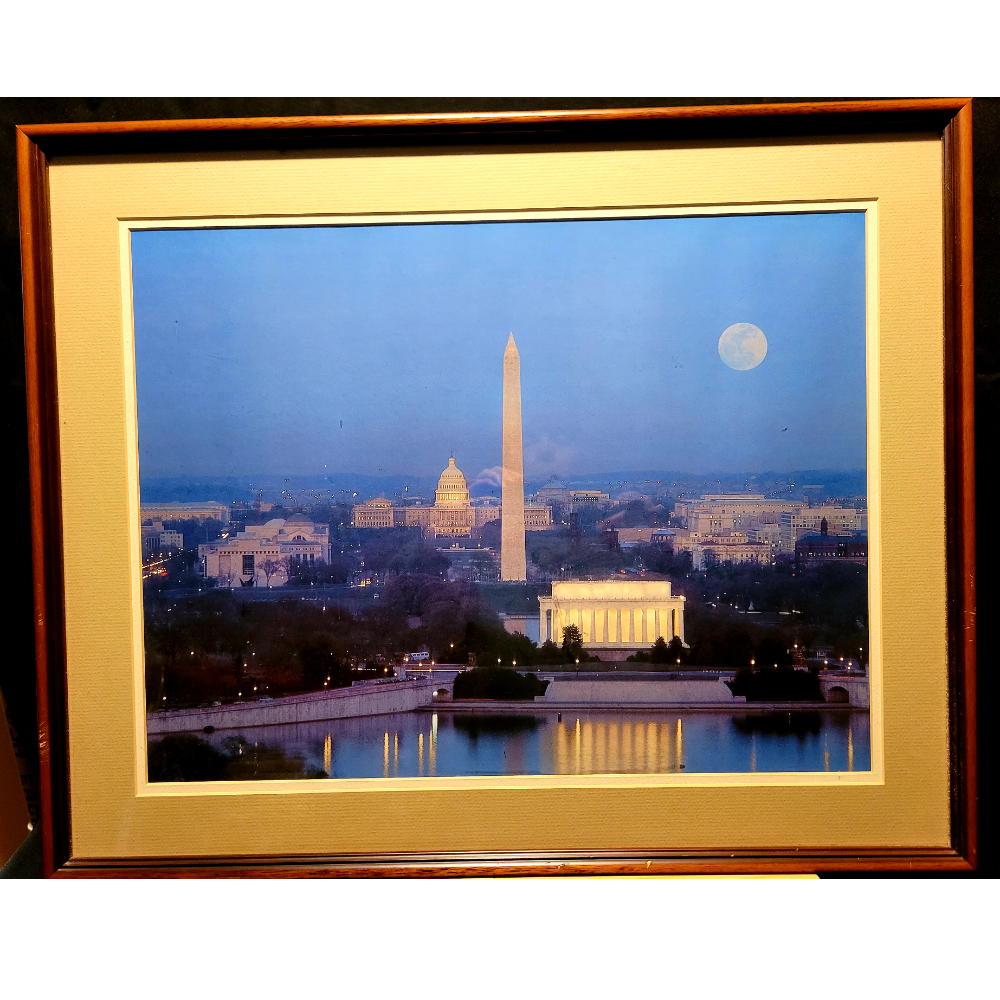 Large framed photo of the monuments in Washington D.C. at nightfall