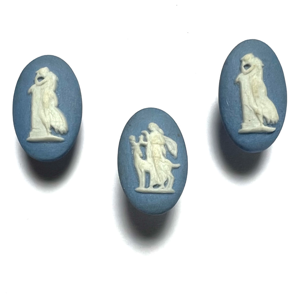 Three oval Wedgwood buttons of classical figures.   