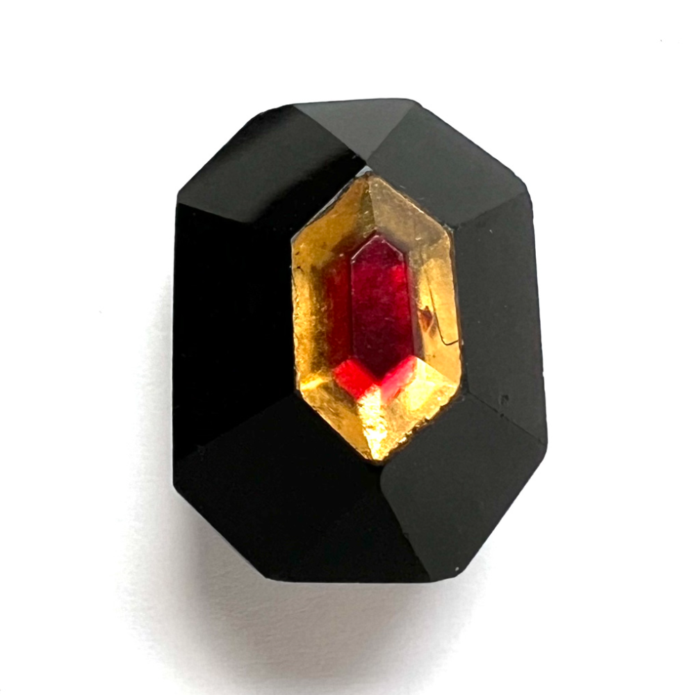 Black glass Tingue octagonal shape button. 