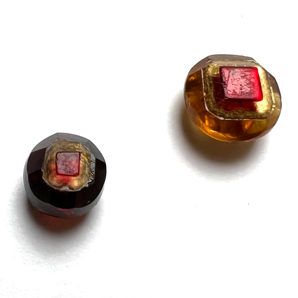 Two different glass Tingue buttons. 