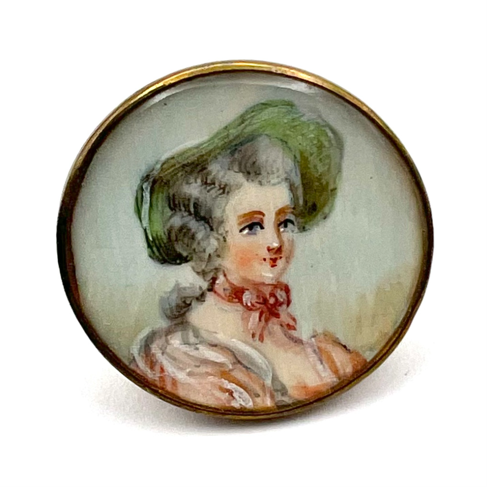 Woman in hat button.