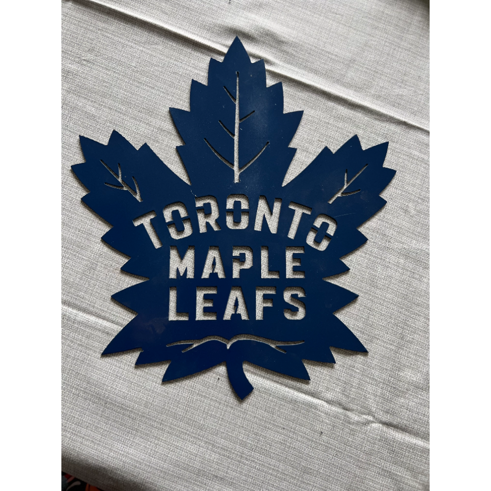 Unique blue stainless steel Toronto Maple Leaf logo sign donated by Metalworx